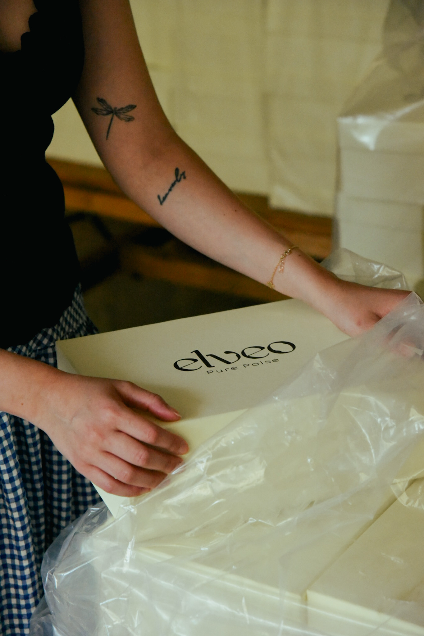 Elveo shoe boxes being packed by hand in the atelier